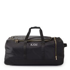 Elegantly functional and conveniently configured, the Terminal 1 Rolling Duffle is crafted from high quality recycled nylon accented by gold hardware and vegan leather details. Sized just right for longer getaways, it has a spacious main compartment and a side compartment great for keeping shoes or smaller items separate. Features two top handles for carrying and a telescoping handle for easy rolling. Add a monogram to put a personal touch on your travel.    28"w x 16"d x 12.5"h  Recycled polyes Rolling Duffle Bag, The Terminal, Mark And Graham, Everyday Moments, Pottery Barn Kids, Corporate Gifts, Inspirational Gifts, Travel Luggage, Personal Touch