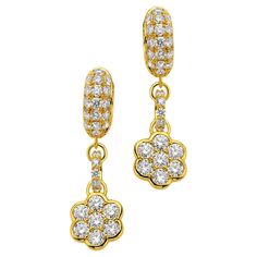 Embrace the exquisite charm of the 20K Yellow Gold Flower Huggie Drop Earrings, a stunning creation by the renowned designers at Buddha Mama. These captivating earrings feature intricately crafted floral motifs, each petal meticulously shaped from lustrous 20K yellow gold. The flowers are adorned with a total of 1.15 carats of brilliant diamonds, carefully set to maximize their sparkle and enhance the luxurious glow of the gold. The diamonds, renowned for their exceptional clarity and brilliance, create a dazzling contrast with the rich golden hue, adding a touch of refined opulence. Designed to hug the earlobe comfortably, these huggie drops offer a seamless blend of sophistication and contemporary style. Perfect for adding a touch of glamour to any ensemble, these earrings are a testamen Eastern Philosophy, Creating Jewelry, Diamond Flower, Gold Flower, Floral Motifs, Brilliant Diamond, Gold Flowers, Jewelry Branding, Floral Motif