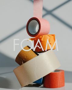 several rolls of toilet paper stacked on top of each other with the word foam above them