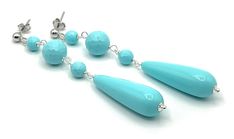 A pair of elegant earrings crafted with Italian 925 sterling silver, turquoise resin drops and faceted beads. LENGTH: 3 inches - 8 cm  WEIGTH: 5 gr.  Drop: 30 x 10 mm Faceted beads: 10 - 6 mm Matching necklace https://www.etsy.com/uk/listing/1269140421/turquoise-chunky-necklace-big-bold?click_key=67028e9a2bc8b891d8383a9f922ee51ef3037043%3A1269140421&click_sum=2d89f659&ref=shop_home_active_47&pro=1&frs=1&sts=1 MATERIALS: 925 Sterling Silver - Made in Italy Resin DELIVERY: All jewellery is shipped Handmade Turquoise Briolette Earrings, Turquoise Teardrop Faceted Earrings, Turquoise Faceted Teardrop Earrings, Faceted Turquoise Teardrop Earrings, Turquoise Teardrop Earrings With Faceted Beads, Turquoise Briolette Earrings For Gift, Turquoise Briolette Earrings As A Gift, Turquoise Faceted Bead Earrings, Turquoise Earrings With Faceted Beads