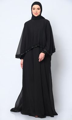 Step into the realm of elegance and sophistication with our stunning 3-piece ensemble, meticulously crafted to redefine your style with grace and beauty. The focal point of this ensemble is the Abaya, featuring a delicately embroidered border that adds a touch of regal charm to its classic silhouette. This Abaya,  Acco Elegant Long Sleeve Wedding Niqab, Cape Abaya For Evening And Eid, Elegant Long Niqab For Eid, Elegant Long Embellished Sets, Elegant Cape Sets For Eid, Elegant Eid Cape Sets, Elegant Black Cape Abaya, Elegant Embellished Maxi Length Sets, Elegant Festive Cape Kaftan