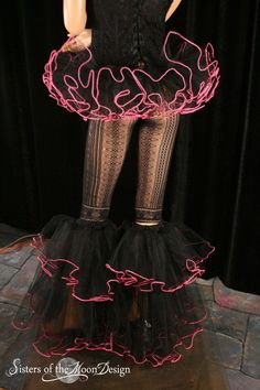 "Your buying the tutu and the matching boot covers~ Raver set hip hugger Adult tutu mini skirt and boot covers in Black tulle with Hot pink trim MINI SKIRT 6\" long - Handmade from two layers around 25yards of soft smooth white glimmer Bridal tulle, that has been gathered and serged to the black fabric covered elastic waistband then trimmed with UV hot pink yarn. Trim is UV reactive, it will glow under black light! This tutu is super short at only 6\" long - Hip huger style this tutu is complete Mini Skirt Leg Warmers, Skirt Leg Warmers, Dance Team Costumes, Smallest Waist, Team Costumes, Boot Covers, Black Bridal, Skirts With Boots, Uv Reactive