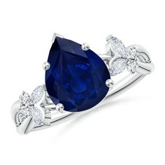 a blue sapphire and diamond ring on a white background