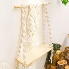 a macrame hanging on the wall next to other items