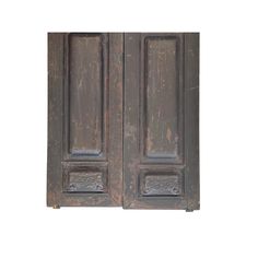 an old wooden door with metal handles on the outside and inside doors are painted dark brown