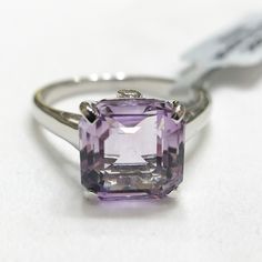 Nwt Pink Amethyst With White Topaz Accents Sterling Silver Ring. Certificate Of Authenticity Size 9 Avg. Metal Wt: 2.85g No. Of Gems: 3 Carat Weight: 5.0100cts (Avg) Length Of Design: 11.00mm X Width Of Design: 10.00mm Pink Amethyst: 4.97 Ct (10mm X 10mm) Origin: Brazil Setting: Prong White Topaz: 2 Round Stones (1.5mm X 1.5mm) Modern Amethyst Anniversary Ring, Round Cut Amethyst Gemstones, Formal Kunzite Jewelry With Prong Setting, Formal Silver Kunzite Jewelry, Hallmarked White Gold Amethyst Ring, Formal White Gold Gemstones, Classic Amethyst Gemstones In White Gold, Classic White Gold Amethyst Gemstones, Formal Amethyst Ring In Sterling Silver, Vs Clarity