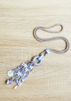 This long necklace is all hand sewn, and made with various kinds of beads. The focal point are the strands, finished with beautiful glass cabochons and a mandala charm. It will be shipped with an organza bag and shipped with a tracking number in a padded envelope. For more necklaces please check: https://www.etsy.com/shop/CinziaDesign?section_id=15986977&ref=shopsection_leftnav_4 My shop: https://www.etsy.com/shop/CinziaDesign?ref=hdr_shop_menu Handmade Bohemian Beaded Lariat Necklace, Handmade Bohemian Lariat Beaded Necklace, Handmade Lariat Festival Necklace, Handmade Festival Lariat Necklace, Bohemian Beaded Lariat Necklace, Bohemian Lariat Necklace With 108 Beads, Bohemian Lariat Necklace With Beaded Chain, Handmade Lariat Necklace For Festivals, Bohemian Long Necklace With Faceted Beads As Gift