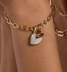 The small heart charm is engravable to showcase your favorite friends and loved ones. You have a heart of gold and now you’ve found the perfect pair. 
See here for additional heart charms. Find here RELLERY's best-selling bar bracelet. Affordable Gold Nameplate Charm Bracelet, Luxury Handmade Silver Charm Bracelet, Luxury Logo Charm Bracelet For Gift, Cheap Gold Charm Bracelets, Cheap Adjustable Nameplate Charm Bracelet, Luxury Classic Gold Charm Bracelet, Elegant Bracelet For Mother's Day, Gold Designer Necklace, Charm Bracelet Ideas