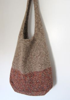 a brown and red bag hanging on the wall