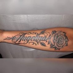 an arm with a rose and name tattoo on it