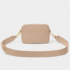 Look chic and stay organized with the Zana Mini Crossbody Bag! Featuring golden hardware, a convenient slip pocket, and a wide, detachable crossbody strap, this soft tan bag is the perfect accessory for any style. Carry your essentials with ease and look fabulous! Details Color: Soft Tan Dimensions: 5" x 2" x 7.3" Zana Mini Crossbody Bag By Katie Loxton Katie Loxton, Tan Bag, Faux Leather Handbag, Leather Handbags Tote, Genuine Leather Handbag, Mini Crossbody Bag, Mini Crossbody, Stay Organized, Look Chic