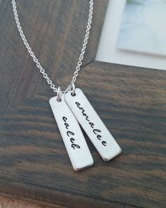 "« Mommy Necklace // Personalized Necklace with Kids Names // Hand Stamped Jewelry // Personalized Name Necklace // Custom Name Bar » If you are looking for the perfect gift for any mom or grandma, this is it! A unique way to carry your loved ones close to your heart! ♥ Each name is carefully hand stamped on a 1.2\" rectangle tag in our gorgeous script font. The rectangles are strung from an 18 inch oval link chain. The rectangles can be personalized with up to 10 characters on each. Please choo Everyday Hand Stamped Rectangular Necklace, Everyday Rectangular Hand Stamped Necklace, Simple Hand Stamped Necklace As Gift, Adjustable Stamped Necklace For Everyday Wear, Adjustable Stamped Necklaces For Everyday, Everyday Handmade Rectangular Necklaces, Handmade Rectangular Everyday Necklace, Everyday Handmade Rectangular Necklace, Everyday Name Pendant Charm Necklaces