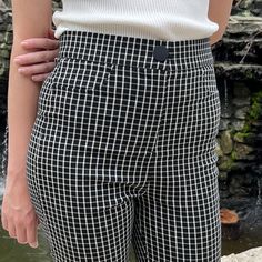 Add modern style to your wardrobe with these checkered-pattern skinny leg pants. Featuring decorative pockets, a snap button and a high waist, these are designed to be both comfortable and flattering. The black and white checkered print adds a urban styling, taking them from work to date night. Small is 28.5" inseam and 28.5" waist. Stretchy, but go up a size if you have bigger hips. Made in China 75% rayon; 22% polyester; 3% spandex Hand wash cold Chic Plaid Straight Leg Bottoms, Chic Plaid Bottoms For Business Casual, Chic Stretch Plaid Bottoms, Trendy Fitted Houndstooth Bottoms, Chic Stretch Houndstooth Bottoms, Casual Houndstooth Bottoms For Business Casual, Trendy High Waist Houndstooth Bottoms, Casual Houndstooth Bottoms For Business, Trendy Stretch Houndstooth Bottoms