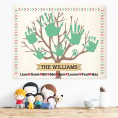 a family tree with handprints on it and two small children's hands