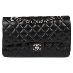 Chanel Black Quilted Lambskin Medium Classic Double Flap Bag Brand- Chanel Model- Medium Classic Double Flap Bag Product Type- Crossbody, Shoulder Serial Number- 10****** Age- Circa 2005 Accompanied By- Chanel Dust Bag, Box, Authenticity Card Colour- Black Hardware- Silver Material(s)- Lambskin Leather Authenticity Details- Serial Sticker, Authenticity Card Height- 15cm Width- 25cm Depth- 7cm Strap Drop- Single: 24cm Double: 43cm Interior- Burgundy Leather Closure- Turn Lock Country of Origin- F Classic Bags With Double Flap And Silver-tone Hardware, Luxury Double Flap Bag With Silver-tone Hardware, Luxury Bags With Silver-tone Hardware And Double Flap, Luxury Bag With Silver-tone Hardware And Double Flap, Business Bags With Silver-tone Hardware And Double Flap, Classic Bags With Palladium Hardware And Double Flap, Classic Bag With Palladium Hardware And Double Flap, Designer Bags With Silver-tone Hardware And Double Flap, Double Flap Bags With Palladium Hardware