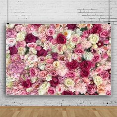 a large floral wall hanging on a brick wall in an empty room with wooden floors