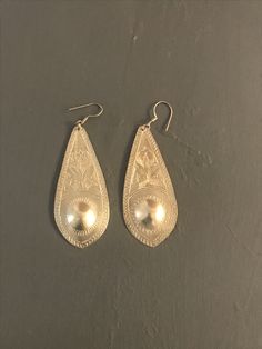 "Indonesian Silver Long Dangle Earrings | Silver Coated Brass | Ethnic Earrings | Boho | Moroccan silver earrings | Vintage  Lightweight dangles Long silver coated brass earrings with silver ear wires Etched leaf design  Length 2.85\" Width at widest part 1.15\"  Vintage" Silver Long Drop Jewelry For Festivals, Silver Teardrop Jewelry For Festival, Ornate Sterling Silver Jewelry With Latkans, Engraved Dangle Earrings For Wedding, Bohemian Silver Teardrop Earrings, Traditional Handmade Sterling Silver Teardrop Earrings, Artisan Silver Teardrop Earrings, Traditional Silver Teardrop Danglers, Traditional Nickel-free Sterling Silver Teardrop Earrings