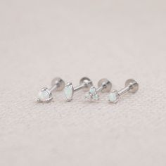 Our opal flat back earrings are dainty and completely waterproof! The 18G flat back design ensures comfort fit, making them ideal for everyday wear as well as special events. - Material: Genuine opal, High quality 925 sterling silver core material, 18 K gold filled, hypoallergenic - Size: Thickness - 18 G/ Length - 8mm  - Qty: sold as 1 piece - Turnaround time: Same day or Next day delivery guaranteed - Packed in gift jewelry box - Please ask me any questions ! I am quick to reply :) Thank you for visiting my shop - For shop policies, please visit: https://www.etsy.com/shop/DoodleJewelrybyDKArt Dainty Internally Threaded Nose Studs As Gift, Nickel-free White Sterling Silver Piercings, White Dainty Cartilage Earrings For Gift, Dainty White Cartilage Earrings For Gift, Dainty White Cartilage Earrings As Gift, Dainty Silver Piercings For Gift, Tiny White Minimalist Piercings, Dainty Nickel-free Silver Nose Studs, Tiny Silver Piercings As A Gift