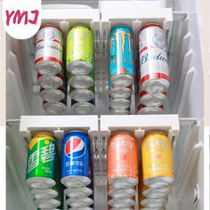 an open refrigerator filled with cans of soda