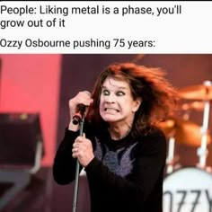 a woman singing into a microphone with the caption people liking metal is a phase, you'll grow out if it