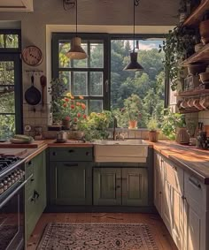 a kitchen filled with lots of green cupboards and counter top next to a window