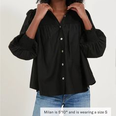 An Effortless, Lightweight Top That Keeps Things Polished And Updated At The Same Time? Count Us In! The Black Jaia Smocked Blouse Checks All The Boxes When It Comes To Closet Staples. Designed With A Classic Button Front Placket, It's The Smocking Details At The Neckline And Cuffs That Make This Style Stand Out From The Rest. For Days When You Don't Know What To Wear And Crave A Put-Together Look, Pair This Timeless Silhouette With Denim Of Any Color And Heels For A Look That'll Feel Good And S Cotton Smocked Top With Smocked Cuffs, Casual Smocked Top With Gathered Sleeves For Daywear, Fall Black Blouse With Smocked Bodice, Black Smocked Blouse For Summer, Black Smock Blouse For Summer, Black Smocked Bodice Blouse For Fall, Black Blouse With Smocked Bodice For Fall, Black Blouse With Gathered Sleeves For Spring, Spring Black Blouse With Smocked Cuffs