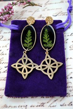 Real fern earrings - Terrarium studs - Witches Knot - Forest witch gift - Mori girl - Strega fashion - Pagan amulet - Wiccan religion    Made with resin and real fern leafs inside. Stainless steel findings for sensitive ears! Dimensions: Width - 0.75'' (1.9cm) Length 2.56" (6.5 cm)   PLEASE NOTE: *It's real plants , so with time they can change color REGULATIONS OF THE USE: *Resin jewelry must be kept separately from other jewelry (to avoid scratches)  *Resin jewelry must be kept avoiding direct Leaf-shaped Jewelry With Matching Earrings, Leaf-shaped Jewelry With Matching Earrings For Gift, Leaf-shaped Jewelry Gift, Hypoallergenic Leaf-shaped Jewelry Gift, Nickel Free Botanical Earrings As Gift, Nickel Free Botanical Earrings For Gifts, Nickel-free Botanical Earrings As Gift, Leaf-shaped Matching Earrings Jewelry Gift, Nickel-free Botanical Style Earrings As Gift