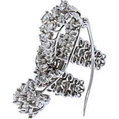 Bask in the glow of luxury, where timeless elegance meets modern aesthetics in the exquisite Platinum 10 Carat Diamond Bow Brooch. This captivating piece features a lustrous diamond bow design, adorned with round-cut diamonds and baguette cuts that showcase a dazzling play of light. With a remarkable estimated carat weight of 10.00cts, this brooch exudes opulence and sophistication.Crafted in luxurious platinum, this brooch is a true testament to fine craftsmanship and enduring beauty. The F-G color and VS1-VS2 clarity of the diamonds ensure a brilliant sparkle that catches every eye. Measuring about 1.5 inches wide, this stunning brooch is a versatile accessory that adds a touch of glamour to any ensemble.Whether worn on a lapel, dress, or scarf, this brooch is a statement of refined eleg Elegant Diamond Brooches With Brilliant Cut, Elegant Diamond White Brooches For Formal Occasions, Luxury Diamond White Brooch With Brilliant Cut, Formal Diamond White Brilliant Cut Brooch, Elegant Platinum Brooches With Diamond Accents, Luxury Platinum Brooches, Formal White Gold Brooches With Diamond Accents, Elegant Diamond Brooches With Accents, Luxury White Gold Diamond Brooches