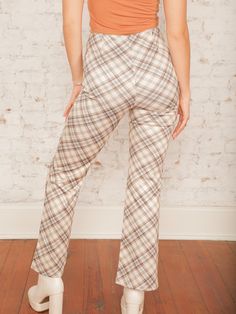 Our Caledonia Plaid Flare Pants are a statement piece that blends retro vibes with modern comfort! Featuring a high-rise fit and ultra-comfy feel, these plaid pants hug your waist and flare out at the hem for a flattering silhouette. Pair them with a fitted turtleneck and booties for a stylish day out or dress them up with a sweater for a fun fall event. Details High Rise Front Zipper No Pockets Plaid Print Fit & Flare Style Ultra Comfy 29 1/2" Inseam Size recs: 0-2 Small, 4-6 Medium, 8 Large, 10 X-Large Provides minimal stretch Model is 5'8" wearing a size Small Plaid Flare Pants, Quilted Outerwear, Fall Wedding Guest, Fitted Turtleneck, Wedding Guest Looks, Skirt Co Ord, Event Details, Pants Large, Jumpsuit Shorts Rompers