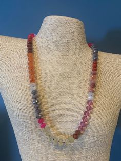 A glowing sunset that is not limited to the magic hour! Carry this beauty with you all day long.  She's made with the following genuine gemstones: pink topaz, pink chalcedony, coral, red jasper, moonstone, selenite, carnelian, yellow opal, and fire agate. Hand knotted on red nylon for the most flattering drape and movement, she measures approximately 21 inches long.  Finished with gold filled end beads, gold filled closed jump rings, and a gold filled clasp. This clasp gives you the option of adding a charm and is also interchangeable if you'd like to switch it out with another from your collection.  The stones measure approximately 7mm to 8mm and are a delicious mix of faceted and smooth gemstones. Beaded Rainbow, Candy Necklace, Pink Chalcedony, Candy Necklaces, Yellow Opal, Rainbow Gemstones, Magic Hour, Rainbow Necklace, Jewelry Beaded