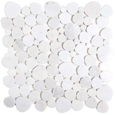 white marble circles are arranged in a square pattern on the floor, with one circle at the center