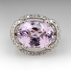 This kunzite ring is centered with one (1) oval mixed cut natural kunzite set into a four-prong setting. The ring is also accented with eighty-four (84), prong set, round brilliant cut diamonds. The ring measures 18.0mm at the top, rises 11.9mm above the finger, tapering to 3.5mm wide and 1.3mm thick at the base of the shank. It is currently a size 8.75. Exquisite Pink Sapphire Rings For Formal Occasions, Exquisite Pink Sapphire Rings For Formal Events, Formal Morganite Gemstone Rings, Luxury Pink Oval Topaz Ring, Pink Gemstones For Formal Fine Jewelry, Classic Pink Gemstones For Formal Occasions, Pink Gemstones For Formal Occasions, Oval Morganite Ring For Formal Occasions, Elegant Round Pink Sapphire Gemstones