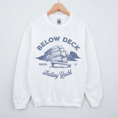 This sweatshirt is a must have for Below Deck Sailing Yacht. Celebrate Captain Glenn and the Parsifal Crew. Get one for the Yachtie in your life Ideal for any situation, a unisex heavy blend crewneck sweatshirt is pure comfort. These garments are made from polyester and cotton. This combination helps designs come out looking fresh and beautiful. The collar is ribbed knit, so it retains its shape even after washing. There are no itchy side seams on these sweaters.  .: 50% cotton, 50% polyester .: Bravo Tv, Below Deck, Sailing Yacht, Sew-in Labels, Unisex Sweatshirt, Crewneck Sweatshirt, Sweat Shirt, Ribbed Knit, Crew Neck Sweatshirt