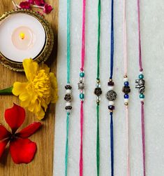 Each rakhi is handmade with colorful beads and unique designs. Bohemian Multicolor Bracelets For Navratri, Bohemian Handmade Beaded Bracelets For Celebration, Motif Bracelets For Diwali Gift, Multicolor Diwali Motif Bracelets, Multicolor Motif Bracelets For Diwali, Diwali Multicolor Motif Bracelets, Multicolor Diwali Bracelets With Motifs, Handmade Bracelets As Diwali Gifts, Diwali Gift Bracelets With Motifs