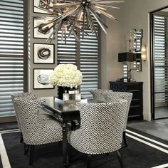 an elegant dining room with black and white decor