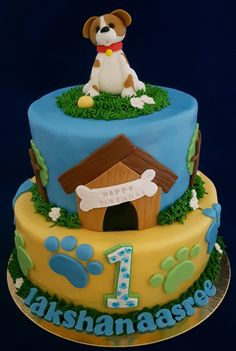 a birthday cake with a dog on top