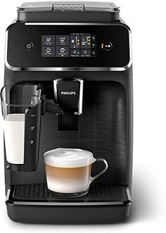 an espresso machine with a cup of coffee next to it