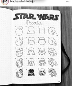 the star wars doodle book is open on top of a wooden table with pencils and