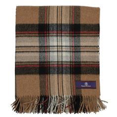 a tan and black plaid scarf with fringes