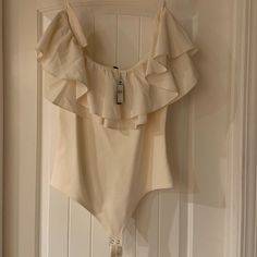 Nwt - Cream Ruffle Off Shoulder Bodysuit From Express Beautiful Color, Soft Material True To Size, W/ Room To Eat Chic Cream Sleeveless Bodysuit, Chic Sleeveless Cream Bodysuit, Summer Party Cream Bodysuit, Chic Cream Bodysuit For Spring, Chic Cream Bodysuit For Summer, Chic Cream Summer Bodysuit, Neon Bodysuit, Off Shoulder Bodysuit, White Lace Bodysuit