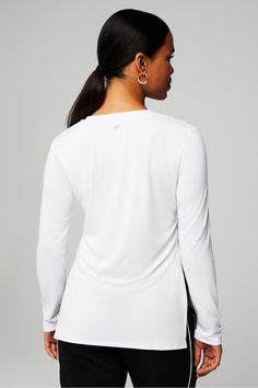 Dry-Flex Long-Sleeve Tunic Fabletics white female Activewear >> Womens >> Tops >> Long-Sleeves >> Long-Sleeve Top regular Running/Training Moisture-Wicking White Long Sleeve Activewear With Thumbholes, Versatile White Top With Thumbholes, White Stretch Activewear For Fall, White Relaxed Fit Long Sleeve Activewear, Female Activewear, Getting Wet, Pull Sweat, Running Training, Intense Workout