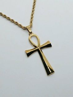 Express UPS shipping upgrade 1-3 day delivery available in cart worldwide  Ankh necklace stainless steel with rope chain,Egyptian ankh jewelry,  ankh gold necklace,  dainty necklace gold , 24k gold filled necklace,  Egyptian cross of life The ankh or key of life is an ancient Egyptian hieroglyphic symbol that was most commonly used in writing and in Egyptian art to represent the word for life and by extension as a symbol of life itself.  These beautiful  ankh gold necklaces are so simple minimal Ankh Jewelry, Egyptian Hieroglyphics Symbols, Dainty Necklace Gold, Egyptian Cross, Egyptian Ankh, Antique Silver Necklace, Symbol Of Life, Ankh Necklace, Minimalist Necklace Gold