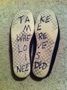 someone's shoes with writing on them that say take me where love is needed