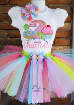 PLEASE REFER TO OUR ANNOUNCEMENT PAGE FOR CURRENT TURNAROUND TIME PRIOR TO PLACING YOUR ORDER!  AS ABSOLUTELY NO REFUNDS/CANCELLATIONS ONCE ORDER IS PLACED This is the perfect birthday outfit for your Sweet Little One! -Available for ages 1 to 9 years ( please specify child's age in notes at checkout) -Great for pictures this bodysuit/shirt is embroidered with beautiful high quality Lavender, Pink, Light Blue, & Hot Pink, and Apple Green colored thread along with high quality vinyl solid & glitt Sweet Pink T-shirt For Birthday, Sweet One Birthday Outfit, Donut Birthday Shirt, Custom Kids Clothes, Sweet One Birthday, Cupcake Shirt, First Birthday Tutu, Candy Birthday, Handmade Tutu