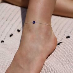 A delicate anklet with blue evil eye bead - as fine as can be, must-have for the summer season. Protect me - Evile eye. Made of high-quality 925 sterling silver. arrive with 3 cm extender chain You will receive a 1-year warranty. Item will arrive in pretty gift packaging, ready to give. 0.6 mm sterling silver Cardano chain. Lobster clasp. available in 2 lengths: 20 cm + 3 cm extender chain 23 cm + 3 cm extender chain Adjustable Evil Eye Anklets As Gift, Dainty Adjustable Sterling Silver Anklets, Sterling Silver Anklets For Summer Gifting, Sterling Silver Anklets For Summer, Dainty Sterling Silver Anklets For Summer, Minimalist Hypoallergenic Sterling Silver Anklets, Adjustable Hypoallergenic Sterling Silver Anklets, Handmade Minimalist Anklet For Gift, Minimalist Handmade Anklet As Gift