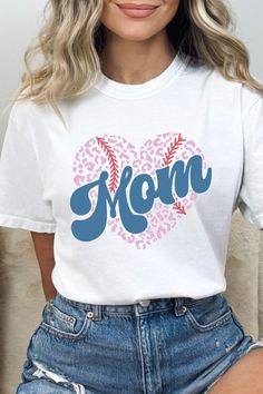 This Comfort Colors Mom t-shirt features red and blue and a cute heart shaped baseball graphic. This short sleeve tee would be perfect for any loving baseball mama who spends long days at the baseball field and is proud of her big (or little) baseball star. #baseball #baseballmom #baseballmama #mama #momlife #boymom #boymomlife #giftformom #mothersdaygifts #tshirt #tee #tshirtsforwomen #graphicteeoutfit Baseball Mom Shirt, New Mama, Baseball Mama, Graphic Tee Outfits, Baseball Mom Shirts, Mama Tee, Mom Tees, Boy Mom, Baseball Mom