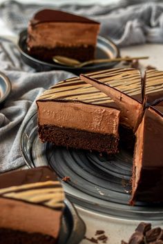 there is a piece of chocolate cake on the plate and one slice has been cut