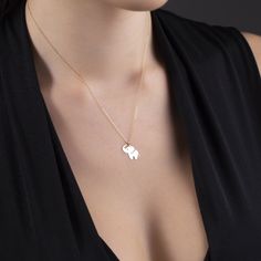 Introducing our stunning 14k Gold Elephant Necklace, a symbol of strength, wisdom, and grace. This exquisite piece is meticulously crafted for women who appreciate timeless elegance. Made with love and attention to detail, this necklace showcases a beautifully detailed elephant pendant, symbolizing good luck and positive energy. The delicate 14k gold chain adds a touch of glamour, making this necklace a versatile accessory that can be worn for any occasion. Treat yourself or surprise a loved one Minimalist 14k Stamped Jewelry Gift, Dainty 14k Stamped Necklace, Graceful Sterling Silver Jewelry For Gifts, Delicate Engraved White Gold Jewelry, Elegant Engraved Gold Plated Jewelry, Elegant Engraved Gold-plated Jewelry, Dainty 14k Stamped Jewelry, Dainty Sterling Silver Jewelry Stamped 14k, Dainty Engraved Jewelry For Formal Occasions