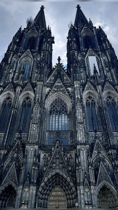 the large cathedral has many windows on it's front side and is very ornate