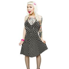 Go On And Swing The Night Away In This Darling Dress From Sourpuss! The Sweetheart Of Swing Dress Features White Polka Dots On A Black Halter Dress With A Faux Wrapped Waist. The Dress Features A Plunging V Neckline And Flared Skirted Bottom. The Back Features An Elastic Band At The Top For A Comfortable Fit. This Dress Is Easy To Wear And Looks Just Amazing On All Sizes! This Dress Runs True To Size, But If A Snugger Fit Is Desired, Please Size Down. Material Content: 95% Polyester 5% Spandex Spring Black Pinup Dress, Spring Pinup Black Dress, Polka Dot Pinup Dress For Summer, Summer Pinup Polka Dot Dress, Summer Polka Dot Pinup Dress, Rockabilly Black Dress For Spring, Black Rockabilly Dress For Spring, Polka Dot Sleeveless Pinup Dress, Black Fitted Pinup Dress